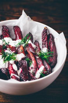 Oven baked beet fries with sour cream and dill dressing