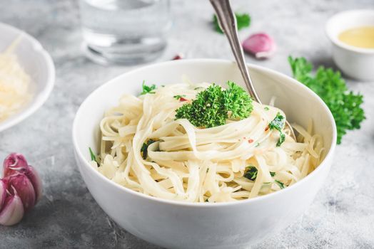 Easy lunch recipe. Linguine pasta with olive oil, garlic, fresh parsley and grated parmesan cheese.