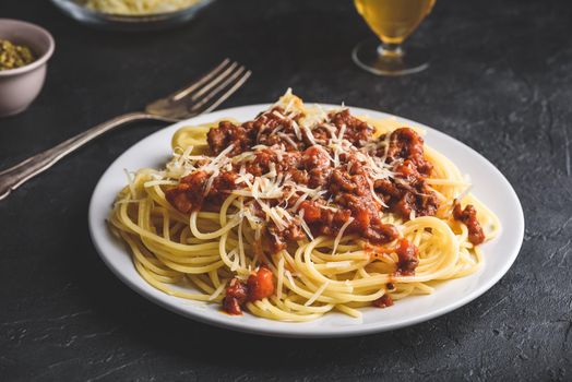 Spaghetti with bolognese sauce and grated parmesan cheese