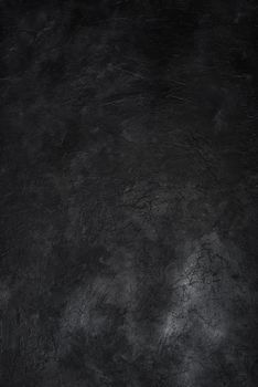 Dark textured concrete wall background. Copy space