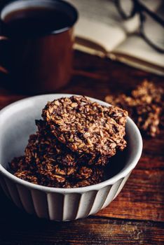 Banana oatmeal cookies with chocolate spread and mug of coffee