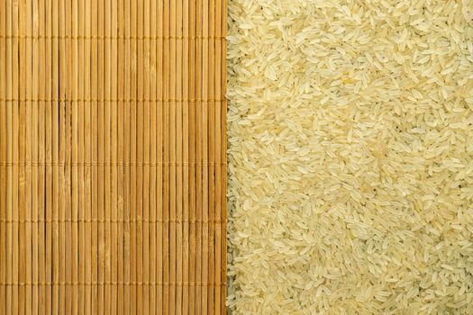 texture of rice grains on a bamboo table close-up. High quality photo