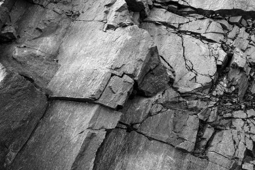 Stone texture, background layers and cracks in sedimentary rock on the rock, abstract background. Cracks and layers of sandstone.
