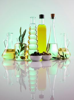 Olive oil bottles, olive branch and Cooking oils