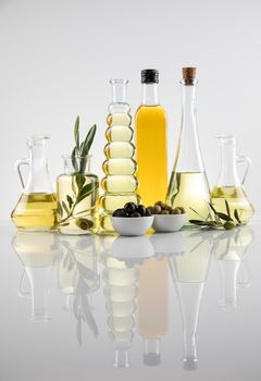 Olive oil bottles, olive branch and Cooking oils