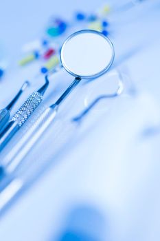 Dentist equipment on blue background