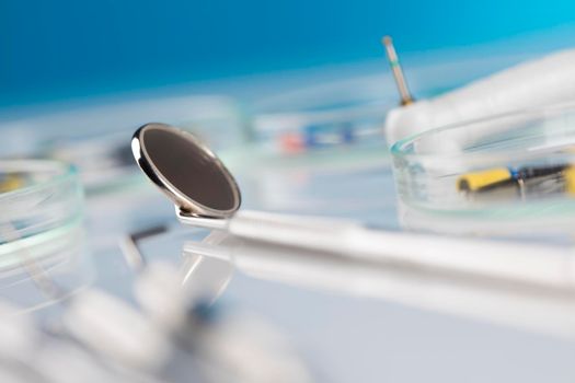 Dentist equipment on blue background