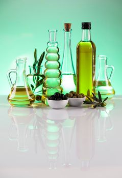 Olive oil bottles, olive branch and Cooking oils