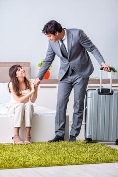 Wife seeing her husband off to business trip