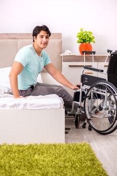 Young handsome disabled man recovering at home 