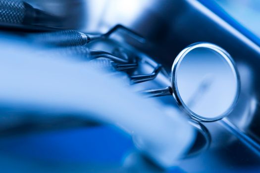 Dentist equipment on blue background