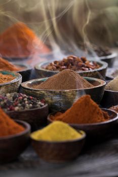 Spices and herbs selection on wooden background