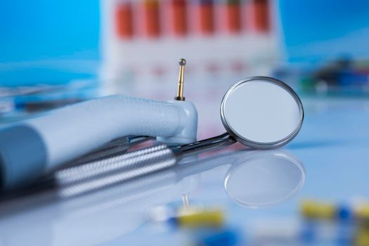 Dentist equipment on blue background