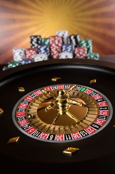 Roulette wheel in motion in a casino background