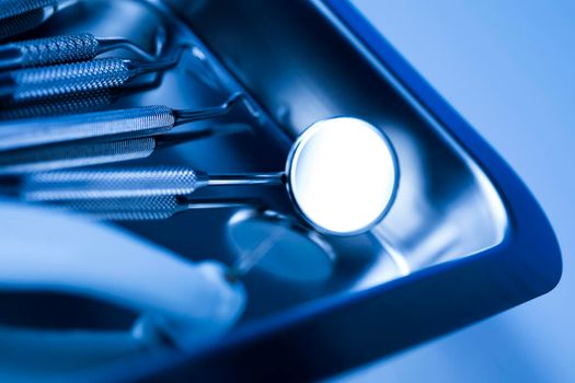 Dentist equipment on blue background