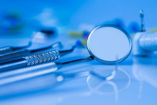 Dentist equipment on blue background