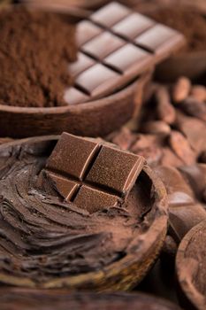 Aromatic cocoa and chocolate on natural paper background