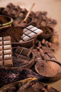 Aromatic cocoa and chocolate on natural paper background