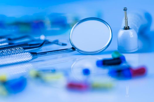 Dentist equipment on blue background