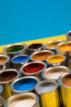 Group of tin metal cans with color paint