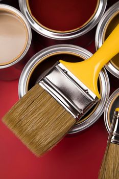 Open paint cans with a brush, Rainbow colors