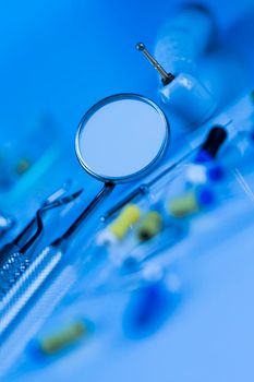 Dentist equipment on blue background