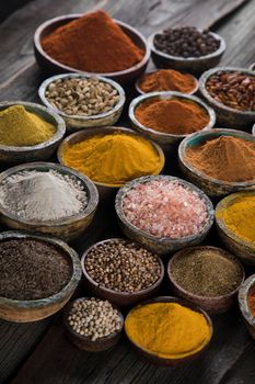 Spices and herbs in wooden bowl Colorful spices