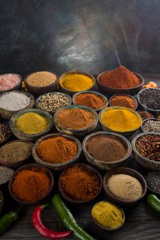 Assorted Spices and wooden bowl of smoke