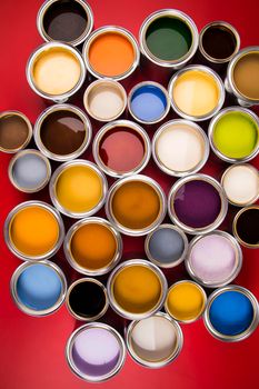 Group of tin metal cans with color paint