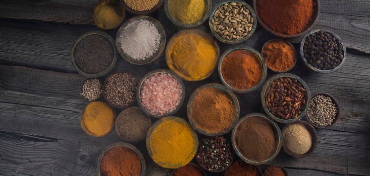 Aromatic spices on wooden background