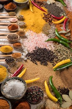 Spices and herbs selection on wooden background