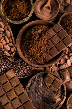 Aromatic cocoa and chocolate on natural paper background