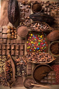 Cocoa beans and chocolate on natural paper background