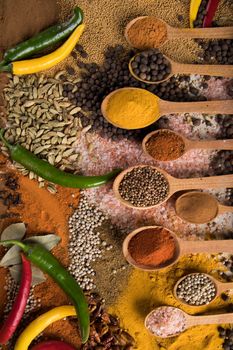 Spices and herbs selection on wooden background