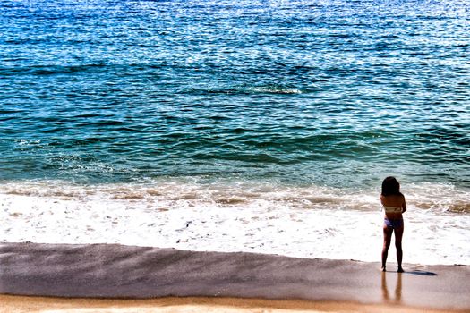 Sesimbra, Lisbon, Portugal- June 1, 2018: Views of the Sesimbra Beach and tourists watching the Atlantic Ocean in a sunny day.