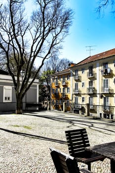 Colorful streets with majestic facades, windows and balconies of Lisbon city in Portugal on a sunny day