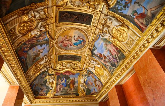 Paris / France - April 05 2019. Inside of richly decorated louvre museum. Beautiful ceiling