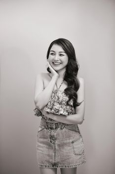 Beautiful sexy asian woman pose against studio background. Black-white photo.