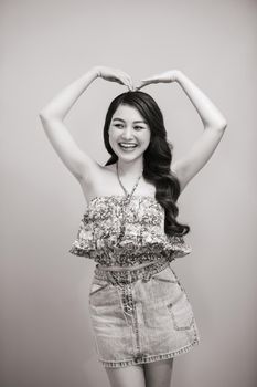 Young beautifull woman in summer dress black-white studio portrait.