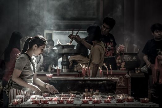 Bangkok, Thailand - 27 Oct 2019 : Interesting Asian women experience Thailand religion culture praying at Dragon Temple Kammalawat (Wat Lengnoeiyi), Wat Leng Noei Yi is the most important Chinese Buddhist temple in Bangkok.
