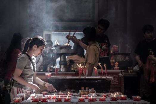 Bangkok, Thailand - 27 Oct 2019 : Interesting Asian women experience Thailand religion culture praying at Dragon Temple Kammalawat (Wat Lengnoeiyi), Wat Leng Noei Yi is the most important Chinese Buddhist temple in Bangkok.