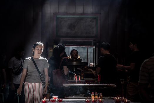 Bangkok, Thailand - 27 Oct 2019 : Interesting Asian women experience Thailand religion culture praying at Dragon Temple Kammalawat (Wat Lengnoeiyi), Wat Leng Noei Yi is the most important Chinese Buddhist temple in Bangkok.