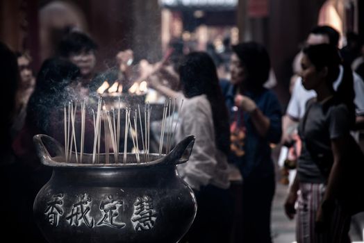 Bangkok, Thailand - 27 Oct 2019 : Incense burning at a temple in Wat Mangkon Kamalawat, Bangkok