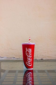 Paper cup with Coca Cola in Bucharest, Romania, 2021