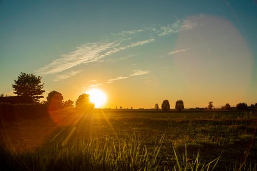 Beautiful and magnificent Sunset in the countryside in the fields