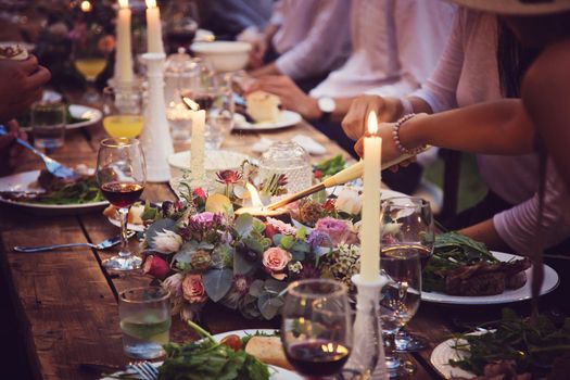 Banquet table in the restaurant with glasses and candles