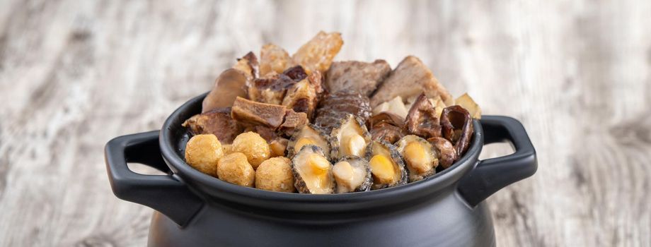 Traditional food of Chinese lunar new year, Buddha jumps over the wall, Chinese Soup Casserole dish, Buddha's Temptation, named Fo Tiao Qiang, close up.