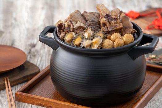 Traditional food of Chinese lunar new year, Buddha jumps over the wall, Chinese Soup Casserole dish, Buddha's Temptation, named Fo Tiao Qiang, close up.