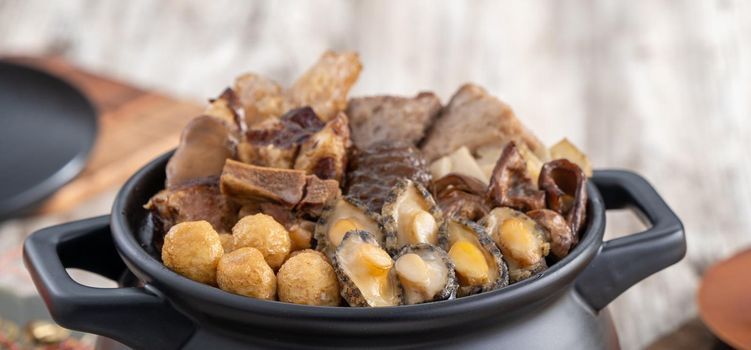Traditional food of Chinese lunar new year, Buddha jumps over the wall, Chinese Soup Casserole dish, Buddha's Temptation, named Fo Tiao Qiang, close up.