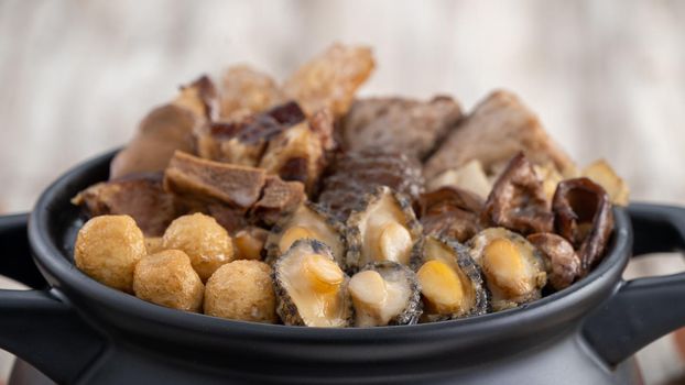 Traditional food of Chinese lunar new year, Buddha jumps over the wall, Chinese Soup Casserole dish, Buddha's Temptation, named Fo Tiao Qiang, close up.